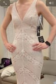 Was worried about the lace quality ordering online, but tried it on and it looks great and is very comfy. Lining looked a bit more pink in person than in the photos, but I like it. Less see-through than other ones but still probably something to keep an eye out for. I was expecting it to be quite long on me but the length was perfect. Might be an issue if you're on the taller side. Perfect for daytime/more casual wedding! - Lydia T.