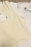 I purchased this top believing it would be White as pictured online and in the description. It's not. It's Ivory. I'm disappointed because I bought it to make a skirt that has white in it and it doesn't match at all. Since I got it on sale I am stuck with it. I took a photo of the top next to a white skirt to show the real color. - Nancy S.