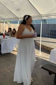 This dress is absolutely beautiful!!!!! And for the price you can't beat it!! I was afraid it would be too small for me. They didn't have a 1X when I ordered so I got an XL and it fit just right. I did get it altered from them length though because it was a bit long for my liking. I did add a bridal belt to it as well for that extra touch. But overall it was just what I wanted for my wedding. Very happy with this dress. - Adriana S.