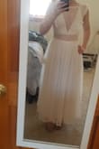This dress was very cute, and for someone who is short, the midi length will actually be almost perfectly full length (at 5 feet tall it hit just above my 2 inch heels). I couldn't wear a bra with this, and I'm very flat chested so that wasn't a problem. The problem I had with the fit was that the side did not zip up all the way for me, but everything else fit perfectly. I guess you just really need a slimmer torso for this if you're going with the XS. Overall I thought it was very pretty but just wasn't quite my style, and would be too cold for an early spring wedding. Perfect for summer! - Dana J.