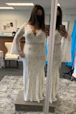 I have been searching for a dress for my elopement this March and really struggled with finding something not over the top but made me feel like a bride and had that "wow" factor. I was hoping Lulu's spring collection would come out in time and thankfully it did. This dress checked all the boxes for me. Absolutely gorgeous! The lace is beautiful, the neckline is stunning, and I love the train. I'm having the bell sleeves altered a bit so they aren't as big and having the train bustled, and I add a jeweled belt. I plan to wear pasties instead of a bra since the cleavage is a bit much and will be wearing Spanx!! Lulus is so great to order from, fast shipping and easy returns. - Dawn H.