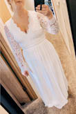 This is a beautiful dress, the seller is the open back. The front is alright, a little grandma-ish. I bought this originally for my wedding dress then returned for something that made me feel sexier and more like a bride. One of the greatest parts was that the sleeves fit! I always have problems with that and the Large fit me perfectly. It also does run a bit long, if I wore this dress I would have had to get it hemmed. I have a smaller waist and big ol hips and this fit me perfectly, a tiny bit tight in the waist but not terrible. In order to be more comfortable I ordered an XL in the other dress I ordered off Lulus. I normally wear size L in tops and size 12 in bottoms. - Ashley D.