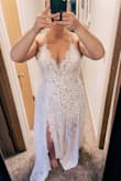 This dress instantly made me feel like a bride and sexy. I had tried on 3 other dresses, 2 from Lulus and one from Amazon. This one was 100% the winner from everyone who saw it. I originally bought a L, then returned for the XL, since the the back on the L was a little tight and my booty was too big for me to snap the onesie. I would recommend if you have a booty to size up. It's better to be covered and comfortable that too tight! The photos attached are from the L. Also. Shoutout to customer service, who expedited my exchange in sizes so gracefully and quickly!, to get here before we left to elope in Maui. That's enough to make me want to keep shopping with Lulus! I'll update when we get our elopement photos back! - Ashley D.