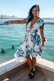 The dress was perfect. Was nice and snug in all the right places and not too tight where it shouldn't be. The material is so light and flowy, I wore it outside in the Florida heat and survived. No material sticking or excess sweating here. - Casey L.
