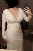 I wanted a simple, comfortable, elegant looking dress for my wedding day and THIS IS IT. I would've ordered a size 8 if it was available, but I decided to try the 6 because the material is stretchy and I'm so glad I did! This is why I said it runs large; I got a smaller size than I normally would. It fits perfectly!! It's pretty long and the sleeves are a bit long, so I'll have to get it hemmed. The cup in the bust can be seen through from the outside, but I'll ask my seamstress to have that removed too. You can see my colorful tattoo through it on my thigh, but that doesn't really bother me. I plan to wear nude shapewear just to make sure no one will be able to see anything else! - Maria R.