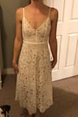 This dress is less structured than I thought it would be in the chest area, but that makes it more comfortable. I had to tighten the straps quite a bit, but the rest of the dress fit very well! It's obviously a little longer than me because of my height, but I actually like it that way too. - Maddie N.
