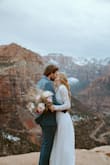 This dress is just insanely beautiful. The details on the top are beautiful, the quality of the crochet is great. It's not heavy, and it is very flowy. My favorite part was the open back, with the scallop details. Such a beautiful dress. - Justine B.