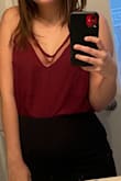 This is a cute top but I would like it a lot more of the chest was a little higher or more snug. I have a very small bust and the shirt sits awkwardly on my chest now matter how I adjust it. It would probably work best without a bra if you have a smaller bust. - Julia H.