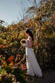 I purchased this dress last min for my elopement wedding without much expectation. The moment I put it on, it felt really great. I didn't have to do any alteration except trimming the length. 

We had our wedding near the ocean, the light material of the dress worked so well with wind. 

I'm really happy with this purchase, plus I bought it on sale. So it was definitely worth the money! - Yunxing L.