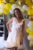This dress fits like a glove, could not be cuter! The length is perfect too, very classy, hits me a little higher than above the knee, but a little lower than mid-thigh. Paired this with cute strappy nude heels and some dangle earrings. I wore this for my bridal shower. Very cute! I'm very happy. :) - Sharaya F.