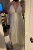 It fits perfectly and is exactly what I was looking for in a wedding dress! Quality material. - Alyssa H.