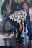 Love this sweater. I'm in a leopard faze and I knew I had to have this. I got the S/M and it still runs a little big, but I love it. It's sooooooooo soft!! Great purchase. - Nikki K.