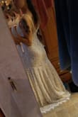 It was too big but that's because they sold out I'd the smallest size and these dresses seem to run big. I didnt choose this dress because there was no wow factor and it was a little boring for my taste but pretty and great for a beach style wedding or if your looking to accesorize. - Heather S.