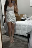 I bought this dress for my bachelorette party in May, and I LOVE it! It fits perfectly and even has a little stretch. I was worried about this purchase since I have a booty and it's white; however the fabric is thick and such good quality. 10/10 love love love - Brittanie T.