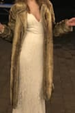 I wore this coat over my wedding dress for a winter wedding. I loved it! It was so warm and soft, and it's incredibly high quality. If I wrapped it tight around myself it closed, but I liked that it stayed open in the front naturally to show off the dress underneath. Even with that tendency, it was super warm. - Taylor R.