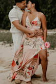I wore this dress for my save-the-date photo shoot. We are having a tropical wedding so it was perfect for the shoot. I love the satin material and the design on it. The dress fit me perfectly. It also accentuates my chest, and I did not have to wear a bra with it! It is flowy and was not too long and I am 5'2"! It fit true to size for me! If you are looking for a nice flowy dress, this is perfect for photoshoots! - Mary C.