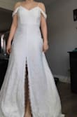 Kinda made me look frumpy compared to the other dresses I tried. The quality is nice, and the train is beautiful, but just doesn't cling the way I want it to. - Raelle V.