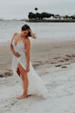 This was actually my "back up" dress for engagement photos that turned out to be the star of the show. I have an athletic build and this dress fit me like a GLOVE right out of the bag. Like I've never had a dress fit so nicely. The photos speak for themselves and I am so happy with my purchase. If I end up hating the other wedding dresses I try on, I may end up getting married in this! 

Just fair warning it is sheer, I have tattoos on my hip that you can ever so slightly see through the lace. - Meghan R.