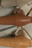 Gorgeous color- was a nude for me when I have a tan in the summer. It's the bottom one on the photo. Although I returned since I listened to reviewers saying size down, it was not true to me. My normal size 6 woulda been better instead of 5.5. I need to reorder these camel ones again, but now debating on camel vs the hazelnut color. - Jacquelyn B.