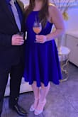 I got this dress for a wedding and it was perfect! The material is a little stretchy and it made this dress fit like a glove. I also didn't have to wear a bra with it, which is always a plus! It has a good length and the twirl you get from the skirt is amazing! - Morgan M.