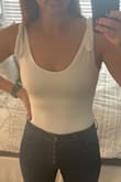 I ordered this bodysuit after I had purchased another one from Lulus that I ended up returning because the straps were too long. This one is perfect because you can adjust the ties to fit a shorter/longer torso. The material feels thick enough so it's not see through at all. - Tara M.