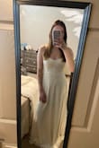 Got this to wear to my adventure elopement in May and when I initially bought this I was super worried it'd look cheap but it's such good quality. The skirt is heavy and has layers to it so it's nice and flattering. I will have to get it hemmed a few inches and am going to replace the straps because I don't like the look of the plastic pieces but I would definitely recommend. Dress looks a lot nicer in person than their stock photos. - Christina M.
