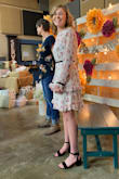 The dress is very flattering!! It looks like a spring time dress. Worn to a bridal shower. The ruffles on bottom make the dress. Very cute style. - Denise M.