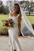 No one would have ever guessed this dress was $88! It's hard to see in the pics but we added a belt detailing (which we got online for less than $20) and had it fitted to me and it was perfect! I borrowed my sister's veil and it was the perfect ensemble. If you are looking for something that can be personalized to you, comfy and easy, and great quality for a lower price I would highly recommend!! My hips are wider so i went with an XL! We had to do a lot of taking in in the bust/waist and just a tad in the hips, but I think a large would have been way too form fitting for the look I was going for! Fitting, dress, and belt detailing still cost less than $200 total. - Kristen T.