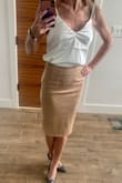 The skirt is beautiful and looks just like it does in the pictures. It is classy yet the suede material gives it a sexy look also. This is my first order from Lulus and I am keeping all 12 items! - Julie D.