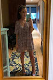 I really like it! It was a little loose, you cant tell by the photo but I still liked the look! Definitely short lol. Super cute, the material feels silky so it kind of sticks to you, just something I noticed while wearing it for a rehearsal dinner. thumbs up! - Olivia W.