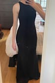 The fabric is quality with a good amount of stretch, and it's plenty long even on taller girls (I could wear 3-4" heels and the dress still hit the floor). But the waist is cut straight, so it doesn't hug my curves or give a feminine silhouette.  It's very tight across my bottom, so sadly no room to size down. Decided to return - Lauren I.