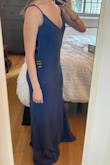 The fabric is quality and has good stretch, and the dress is long enough for 3" heels. It fits a little snug around my bottom (expected with a mermaid silhouette) but a little large on my chest. The adjustable straps help, but I don't like the bracket and extra fabric for adjusting the straps. This is easy enough to fix with a needle and thread, but there is still a little too much fabric. I have a rounded bottom, so unfortunately I don't think I can size down. - Lauren I.