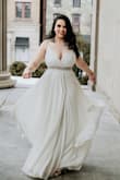 I tried many dresses from Lulus but this was definitely the one for me! It was very comfortable and flowy and it looked amazing in pictures. It was everything I was looking for in a dress to wear on my big day. I added a belt for some sparkle! It was a little bit long for me even with heels on so depending on how tall you are you might need to get it hemmed. - Bruna A.