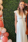 I wore this dress for my bridal shower and received so many compliments! The dress is very low cut, but so flattering and not sleezy. Will note that I am 5'6 and it was a tad long for me even wearing 2 inch heels, can't wait to wear it again - Marissa L.