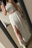 This two piece dress is very cute, but I decided it wasn't for me and went with another more elaborate Lulus wedding dress. The bottom has many layers and is made very nice. I ordered a small first and it was a bit too snug on my 28" waist, the top would have been perfect, though. I exchanged for a Medium and while it fit great, I just wasn't in love with it for my wedding. - Lisa F.