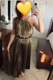 This is perfect for my sister's studio 54 theme wedding reception. It's super fun and flattering. It runs a little large. I'm usually a S or M. I got the S in this dress and it's so heavy (and lined!) that the waist won't stay up. I had to buy a stretchy black belt to wear (the XS was out of stock). It's long too. I'm 5'2" and it comes almost to my ankles. The S fit perfectly under my arms. A XS might've fit better in waist and length, but would've  been too tight under my arms probably. - Sandy G.