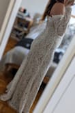 I got this dress as a backup in case my other option didn't get to me in time for my elopement - but it's strong enough to be the first choice, in my view! The silhouette is flattering; the lace is beautiful, especially the trim around the shoulders, and I'll echo other reviewers who say the photos don't do it justice. Yes, it's a bit tight in the arms so you won't be fist-pumping in this dress, but as far as making you feel like a princess - 100%. Wearing it with a 4-inch heel leaves almost no drag on the ground for the skirt. - Olesya S.