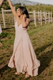 I ordered a size medium in Nude and absolutely love this dress. Looks great on darker skin tones. I ordered it for an engagement photo and it worked out beautifully!!  Definitely recommend ordering based on the size chart. The adjustable straps allow you to lower/raise the height of the chest as you see fit and the hidden slit is great for showing some leg action when wanted. Recommend for any special special occasion or date night! - Kimberlee L.