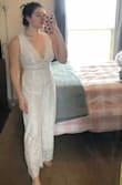 This jumpsuit will be perfect for my casual bridal shower. It's very high-quality because of the double layer of lace with beige under it. It's not see-through at all. The fit is perfect. Usually I have to size up because I have very wide shoulders, but for me a medium ended up working fine. The only thing I would caution is that if you have a very long torso it might give you a slight wedgy. I have a very short torso and the inseam part seems to run up a little high. Other than that I feel gorgeous and I look gorgeous!! - Brieanna J.