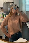 Soft and fits great! Doesn't look cheap. Can wear to work or out for fun. The sleeves have just enough puff. - Alexandra B.