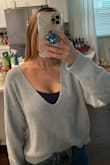 This sweater is definitely off the shoulder and sexy. I recommend wearing something underneath. I tried wearing it while running errands and I probably won't do that again. It's more of a sweater for dinner dates and such. - Alexandra B.