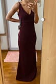This dress is in a gorgeous shade of plum purple and would be perfect for wedding dinners! However, the size runs pretty large and it is quite loose for me (am holding on to the excess fabric with my hand in the photo) despite downsizing to size XS. I would suggest downsizing by two sizes. The straps are rather long too but that can be fixed with a simple alteration. The dress comes with an inner lining and the material is slightly stretchable. - Xinyi L.