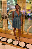This dress is amazing and the light truly makes it shimmer and glisten. The top definitely will need some tape bc it is not fitted, which is why I rated it runs large. However, I am glad I got my size which is small bc the zipper area in the waist is fitted. - Makeda W.