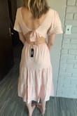 Wow this is such a cute dress. It is the perfect color blush and very flattering. I love that you can adjust the back tie to be looser or tighter. For that reason I think this dress could work well with most cup size. - Jayden J.
