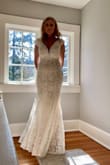 Second wedding for two old folks- so I didn't want to get anything elaborate & didn't want a train. I think this dress covers everything I was asking for and more. I really thought this dress was beautiful on. I do need a bit of alterations in the bust area, but other than that, it fits perfectly wearing 3.5 inch heels. I really like the mesh placed at the cleavage. It really adds a nice touch. Think I'll try and add a belt or something like that too, just to add a visual to give something else to look at for my belly areas. Overall, really like this dress!! - Christina A.