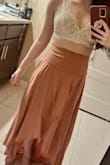 The very edge of the bottom touches the floor, but it is so flowy it blows up into the air when walking. It is very cute and light fabric, and I look forward to wearing it during summer, and I look forward to receiving the green one in the mail too (I couldn't resist getting it too after trying this one)! - Kayleigh R.