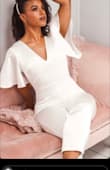 Wore this for a second look during bridal photo shoot. It photographs well and considering the silky material it actually has a slight stretch so when sitting In the jumpsuit you don't feel like you might rip in the bum area. Very comfortable. I also how at the calf it isn't skin tight, there is a bit of room so it give a more classy look. - Amber B.