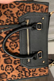 A little big for me but great for work. It's so cute, I always get compliments!! - April L.