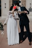 That was the dress of my dreams for my wedding. I bought the L and XL to be sure of the size. I choose the L.
The L was long at the bottom, a little bit loose at the sleeves and adjusted at the waist.
The XL was giant at the bottom and very loose in the sleeves. But more comfortable at the waist, a comfortable loose.
About the quality of the fabric, it is  wonderful. It is very nice and beautiful in person. The price was great too. Oh and it came super very fast. And the return of the XL was also fast and without problems! - Natalia A.