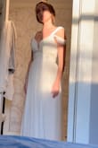 This is my wedding dress that i bought on a whim hoping to be able to dazzle it up! I never expected it to be so perfect though. I ordered an XS because it was the last one in stock and i needed it. I am normally a medium, so this was a crazy stretch that worked out! Don't get me wrong it is tough to zip, but you're definitely  still safe to size down! Added lace under the outer skirt layer and cut the back into a v, so there is a lot you can do with this dress because the price is definitely right! - Taylor M.
